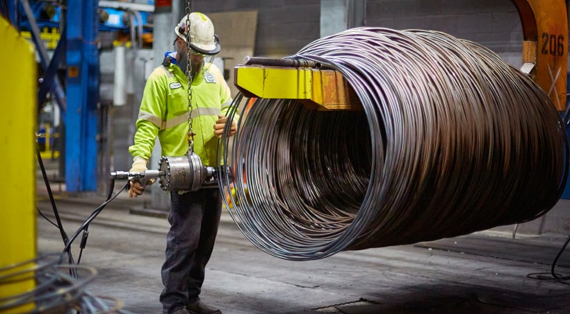 Worker with steel coil